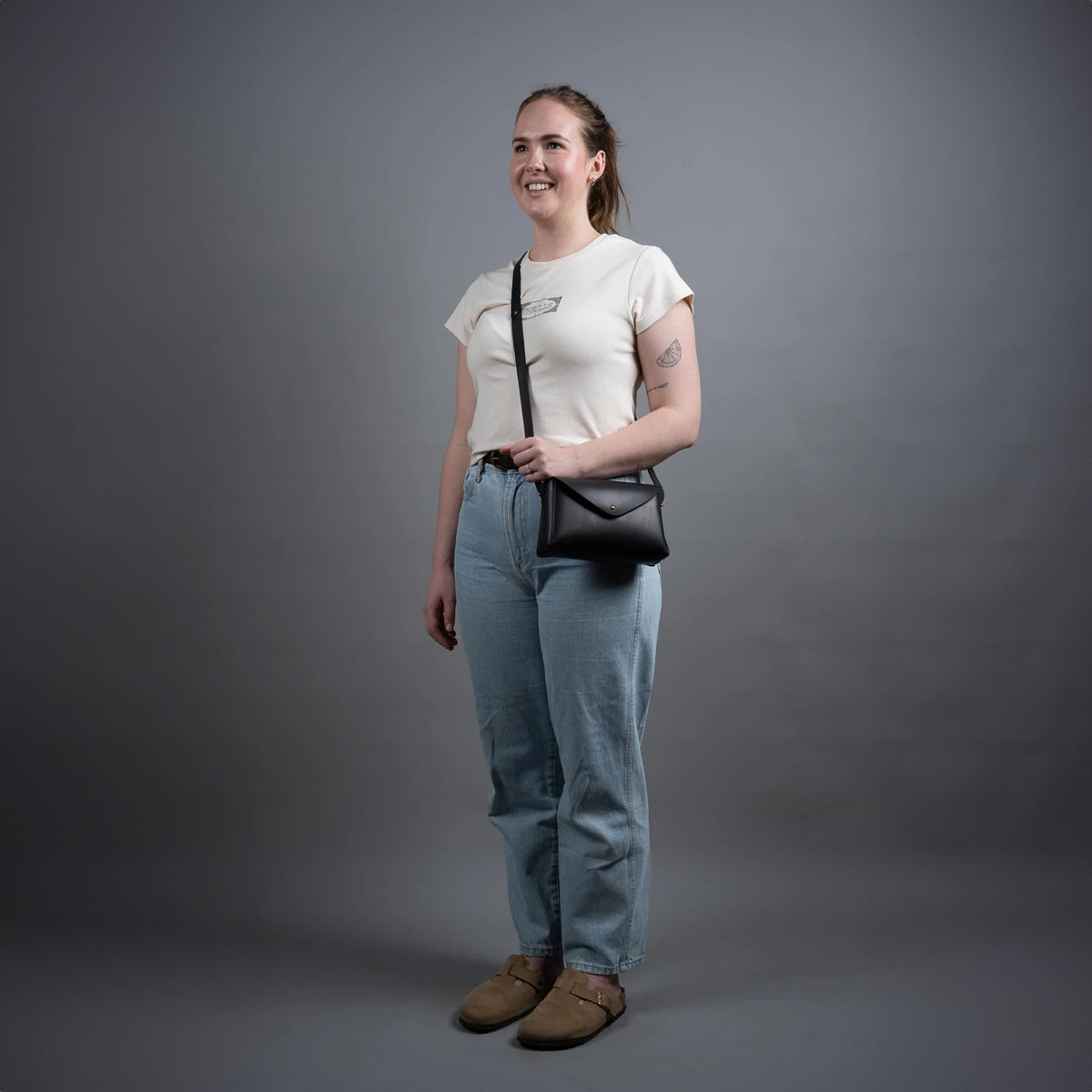 https://cdn.shopify.com/s/files/1/0746/9767/0945/files/dorothyminiblacktheloyalworkshopgreystudioshot.jpg?v=1717579271