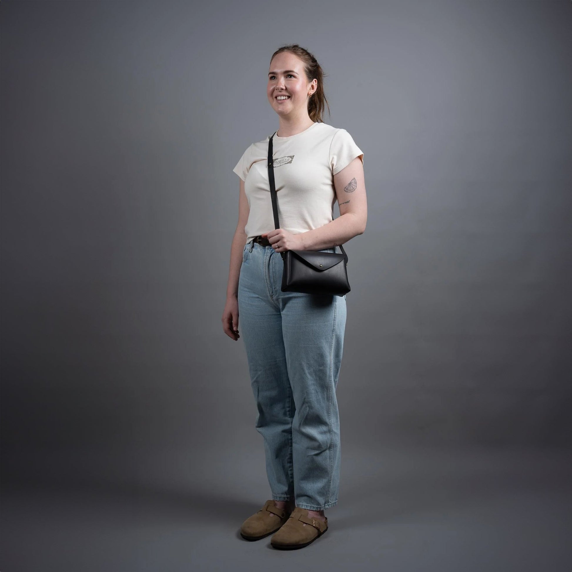 https://cdn.shopify.com/s/files/1/0746/9767/0945/files/dorothyminiblacktheloyalworkshopgreystudioshot.jpg?v=1717579271