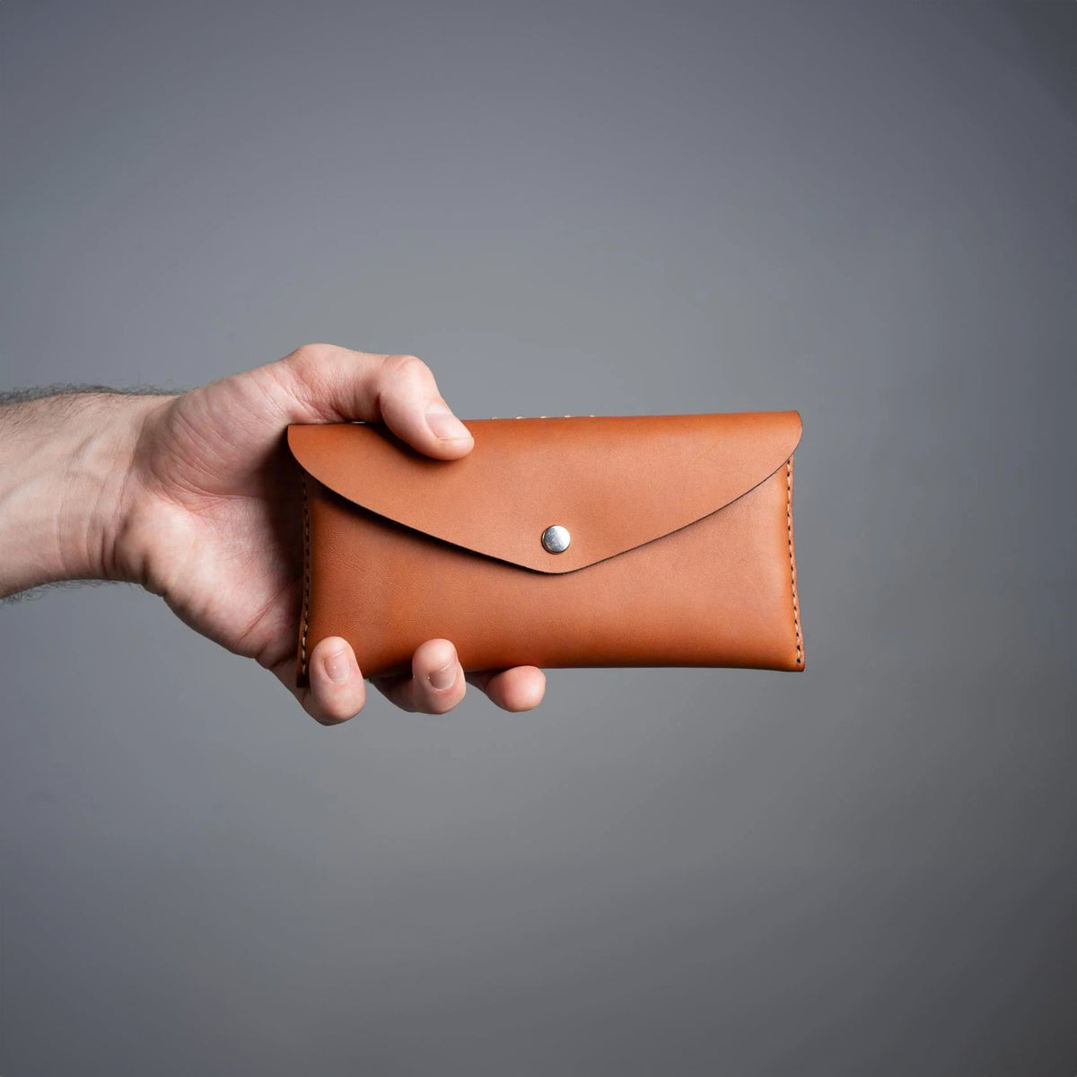 https://cdn.shopify.com/s/files/1/0746/9767/0945/files/leathertoolpouchcognacnewzealand.jpg?v=1717579963