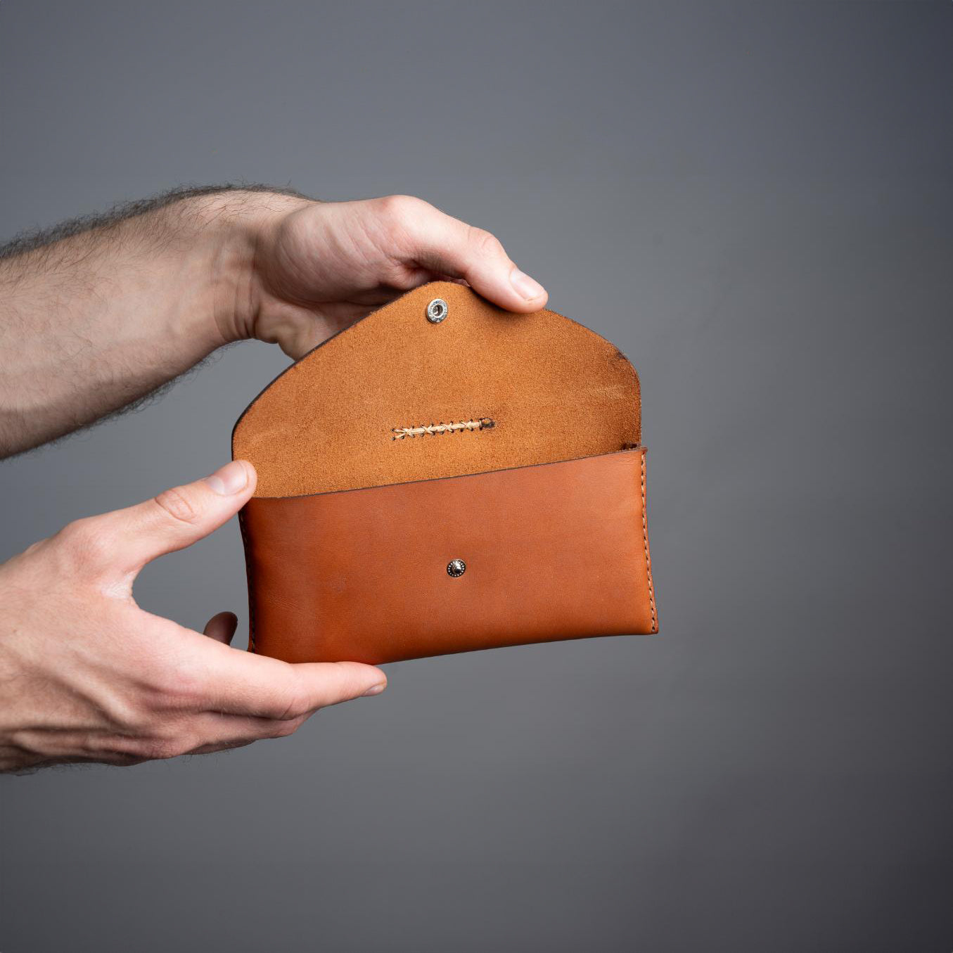 https://cdn.shopify.com/s/files/1/0746/9767/0945/files/openleathertoolpouchcognac.jpg?v=1717579960