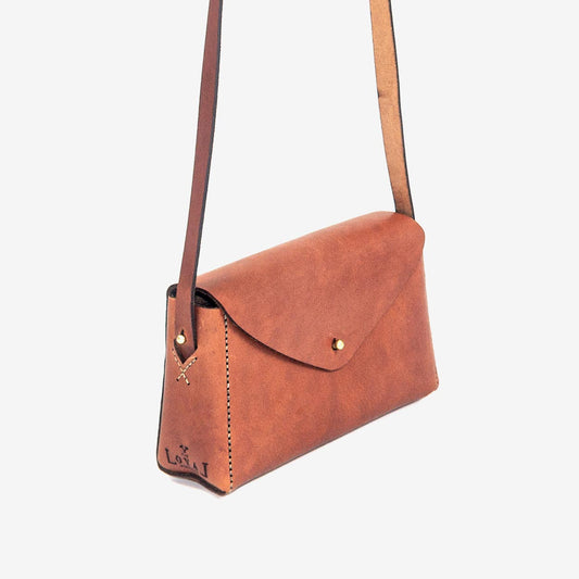 https://cdn.shopify.com/s/files/1/0746/9767/0945/products/the-loyal-workshop-ethical-leather-Dorthy-mini-06.jpg?v=1683082955